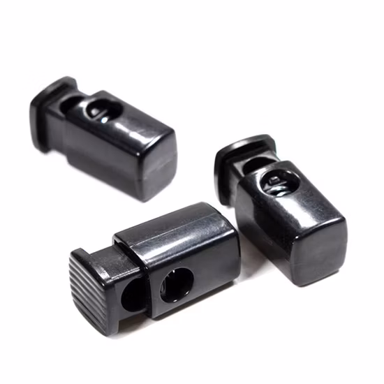 Fabrikspezifische Kordelstopper Endfederstopp-Kippstopper Kunststoff-Federverschluss-Kordelstopper für Kapuzenpullover-Kordelzugkordel