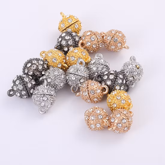 Runde Magnetknöpfe mit Strasssteinen in Schwarz/Gold/Splitter